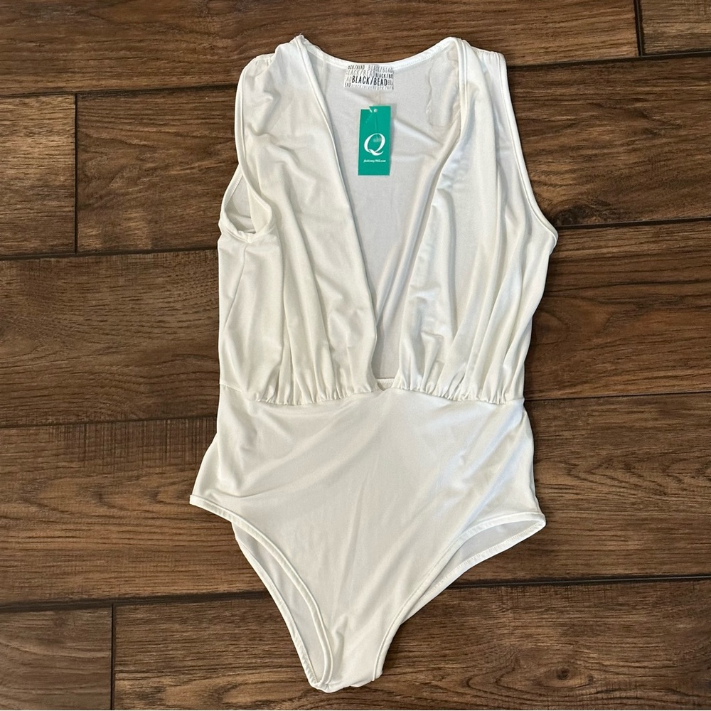 White bodysuit by black bead fashionQ 1982